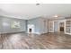 Comfortable living room with fireplace, hardwood floors, natural light, and classic charm at 1411 Cliff Ave, Eustis, FL 32726