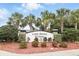 Elegant community sign for Lake Baton Estates, surrounded by lush landscaping and palm trees at 1444 Daystar Ln, Deltona, FL 32725