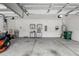 Spacious two car garage with ample room for parking and storage cabinets at 1444 Daystar Ln, Deltona, FL 32725
