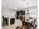 Bright kitchen and dining area with dark cabinets, stainless appliances, and skylight at 1444 Daystar Ln, Deltona, FL 32725