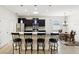 Modern kitchen island with granite countertop, stainless steel appliances, and stylish pendant lighting at 1444 Daystar Ln, Deltona, FL 32725