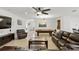 Large living room featuring a billiards table, tile flooring, comfortable seating and a modern ceiling fan at 1444 Daystar Ln, Deltona, FL 32725