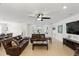 Open concept living area with tile floors, comfortable seating, and views of the backyard at 1444 Daystar Ln, Deltona, FL 32725