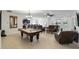 Spacious living room featuring tile floors, ample seating, and an open layout to the kitchen and dining areas at 1444 Daystar Ln, Deltona, FL 32725