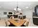 Open floorplan with dining area flowing into a cozy living room with comfortable seating at 1444 Daystar Ln, Deltona, FL 32725