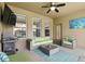 Cozy covered patio featuring comfortable outdoor furniture, a grill and backyard access at 1444 Daystar Ln, Deltona, FL 32725