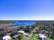 An aerial view showcasing the home's proximity to a beautiful lake at 1518 Lakeside Dr, Deland, FL 32720