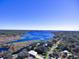 An aerial view showcasing the home's proximity to a beautiful lake at 1518 Lakeside Dr, Deland, FL 32720