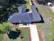 Aerial view of the home showcasing roof, yard and driveway at 1518 Lakeside Dr, Deland, FL 32720