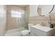 Tiled bathroom featuring a bathtub with shower, a toilet, and a sink with large vanity at 1518 Lakeside Dr, Deland, FL 32720