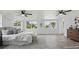 Spacious bedroom featuring light wood floors, white walls and ceilings, and contemporary furnishings at 1518 Lakeside Dr, Deland, FL 32720