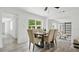 Open concept dining area featuring modern light fixtures and ample seating at 1518 Lakeside Dr, Deland, FL 32720