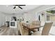 Well lit dining space featuring an open concept, fireplace and kitchen at 1518 Lakeside Dr, Deland, FL 32720