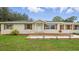 Charming single-story home with front porch and new landscaping at 1518 Lakeside Dr, Deland, FL 32720