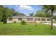 Inviting single Gathering home featuring well maintained landscaping and front yard at 1518 Lakeside Dr, Deland, FL 32720