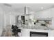 Open kitchen with granite countertops, stainless appliances, and a breakfast bar with seating at 1518 Lakeside Dr, Deland, FL 32720