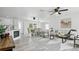 Open concept living space with fireplace, dining and living room at 1518 Lakeside Dr, Deland, FL 32720