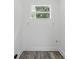 Neutral room with vinyl floors, white walls, trim and ceiling, and a bright window at 1518 Lakeside Dr, Deland, FL 32720