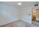 Bedroom with a fan, double closet, and connecting bathroom at 152 Sweetgum Ln, Port Orange, FL 32129