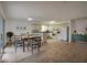 Bright kitchen with white cabinets, modern appliances, and eat-in dining area at 152 Sweetgum Ln, Port Orange, FL 32129