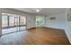 Bright living room featuring wood floors and sliding doors to the outside at 152 Sweetgum Ln, Port Orange, FL 32129