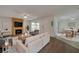 Cozy living room with a fireplace, comfortable seating, and bright light at 152 Sweetgum Ln, Port Orange, FL 32129