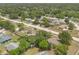Aerial shot showcases a cozy neighborhood with green spaces and tidy residences at 1610 Brady Dr, Deltona, FL 32725