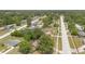 An aerial view showcases the neighborhood's layout, with tree-lined streets and various homes at 1610 Brady Dr, Deltona, FL 32725