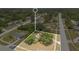 A tranquil aerial view highlights a charming neighborhood surrounded by lush greenery at 1610 Brady Dr, Deltona, FL 32725