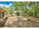 Spacious backyard featuring mature trees, foliage, and a view of the back of the house at 1610 Brady Dr, Deltona, FL 32725
