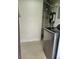 A laundry room featuring a modern, stainless steel washer and water heater at 1610 Brady Dr, Deltona, FL 32725