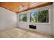 Bright sun room featuring tile flooring, wood paneled ceiling, and large windows at 1610 Brady Dr, Deltona, FL 32725