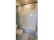 A white bathroom with a toilet and a bathtub with a curtain at 1632 Blue Grass Blvd, Deland, FL 32724