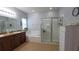 Bright bathroom features a soaking tub, a glass enclosed shower, and dual sinks at 1632 Blue Grass Blvd, Deland, FL 32724