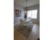 Bright dining area with modern white table and stylish light fixture at 1632 Blue Grass Blvd, Deland, FL 32724