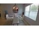 Bright dining area featuring a modern white table set and natural light at 1632 Blue Grass Blvd, Deland, FL 32724