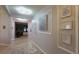 Hallway view of artwork and lighting, connecting different living spaces at 1632 Blue Grass Blvd, Deland, FL 32724