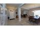 Hallway view showcases an open layout connecting to a dining area and an office, plus front door access at 1632 Blue Grass Blvd, Deland, FL 32724