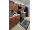 Modern kitchen with stainless steel appliances, granite countertops, and tile backsplash, blending style and functionality at 1632 Blue Grass Blvd, Deland, FL 32724