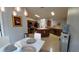 Open kitchen featuring dark wood cabinets, stainless steel appliances and an island at 1632 Blue Grass Blvd, Deland, FL 32724
