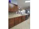 Open kitchen featuring modern cabinets and stainless steel appliances, seamlessly connecting to the living areas at 1632 Blue Grass Blvd, Deland, FL 32724