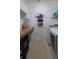 Laundry room with white cabinets, granite countertop, and a modern washer and dryer at 1632 Blue Grass Blvd, Deland, FL 32724