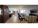 Open-concept living room featuring hardwood floors, a ceiling fan, and seamless flow to other living spaces at 1632 Blue Grass Blvd, Deland, FL 32724