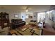 Spacious living room with hardwood floors, an entertainment center, and comfortable seating, providing ample space at 1632 Blue Grass Blvd, Deland, FL 32724