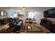 Comfortable living room with modern decor, stylish rug, and media center, perfect for relaxing and entertaining at 1632 Blue Grass Blvd, Deland, FL 32724