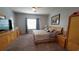 Spacious main bedroom with a ceiling fan and a large window at 1632 Blue Grass Blvd, Deland, FL 32724