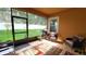 Screened-in patio with tile floors, an outdoor seating area, and a view of the backyard at 1632 Blue Grass Blvd, Deland, FL 32724