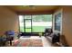 Screened-in patio with tile floors, an outdoor seating area, and a view of the backyard at 1632 Blue Grass Blvd, Deland, FL 32724
