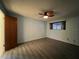 Comfortable bedroom with wood floors, a ceiling fan, and ample natural light at 180 Pine Grove Ct, Daytona Beach, FL 32119