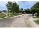 Beautiful single-story brick home with an expansive driveway and decorative lion statues on the front lawn at 180 Pine Grove Ct, Daytona Beach, FL 32119
